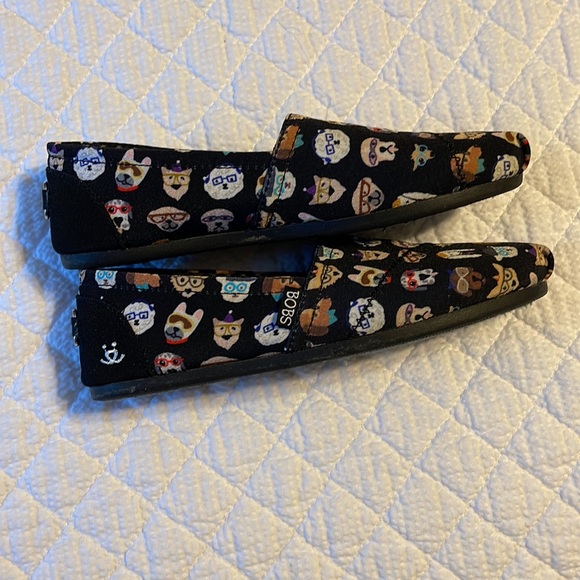 BOBS By Skechers slip on shoes in black with various dog designs on the shoes. - Picture 5 of 8